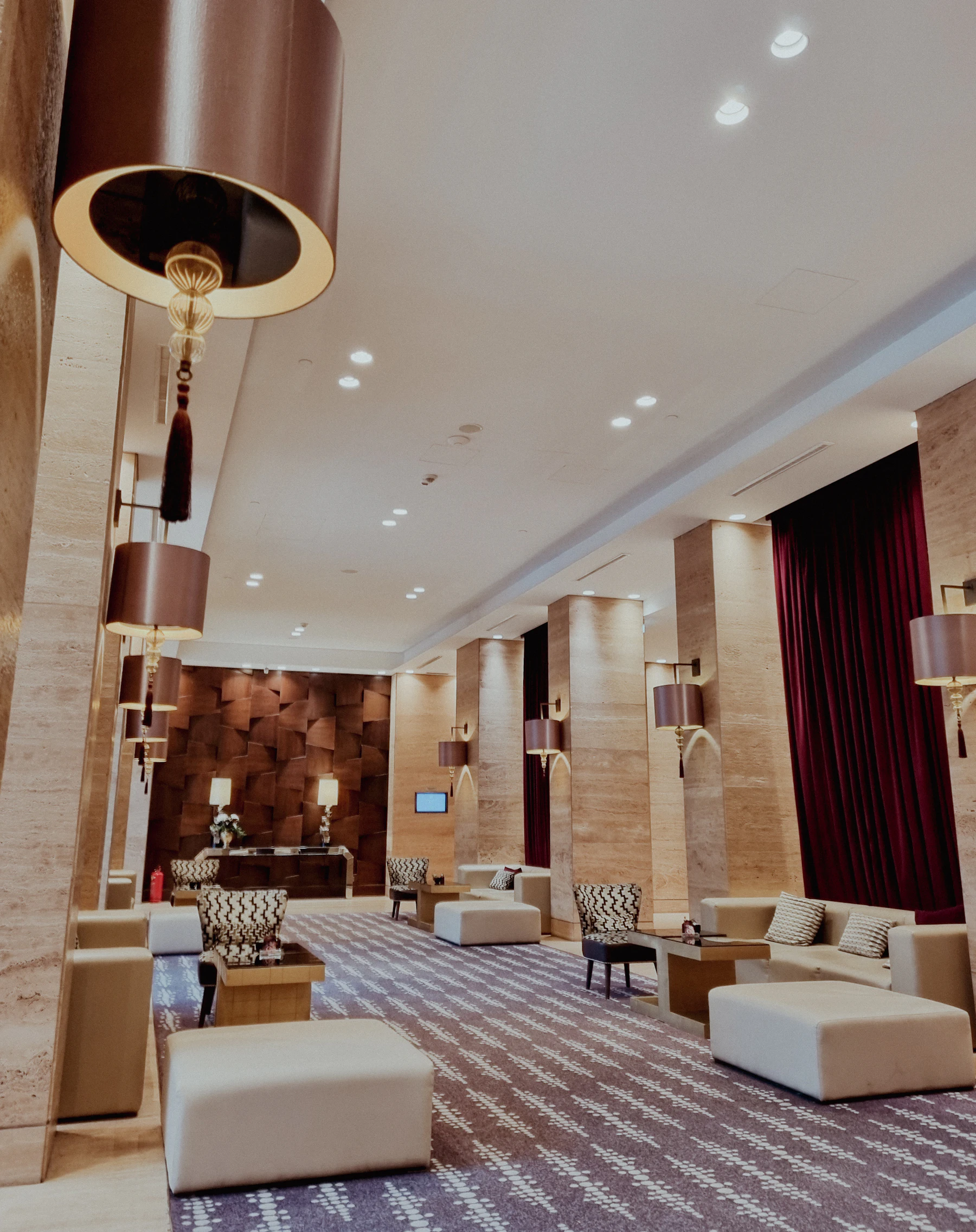 A calm hotel lobby prepared for arriving guests